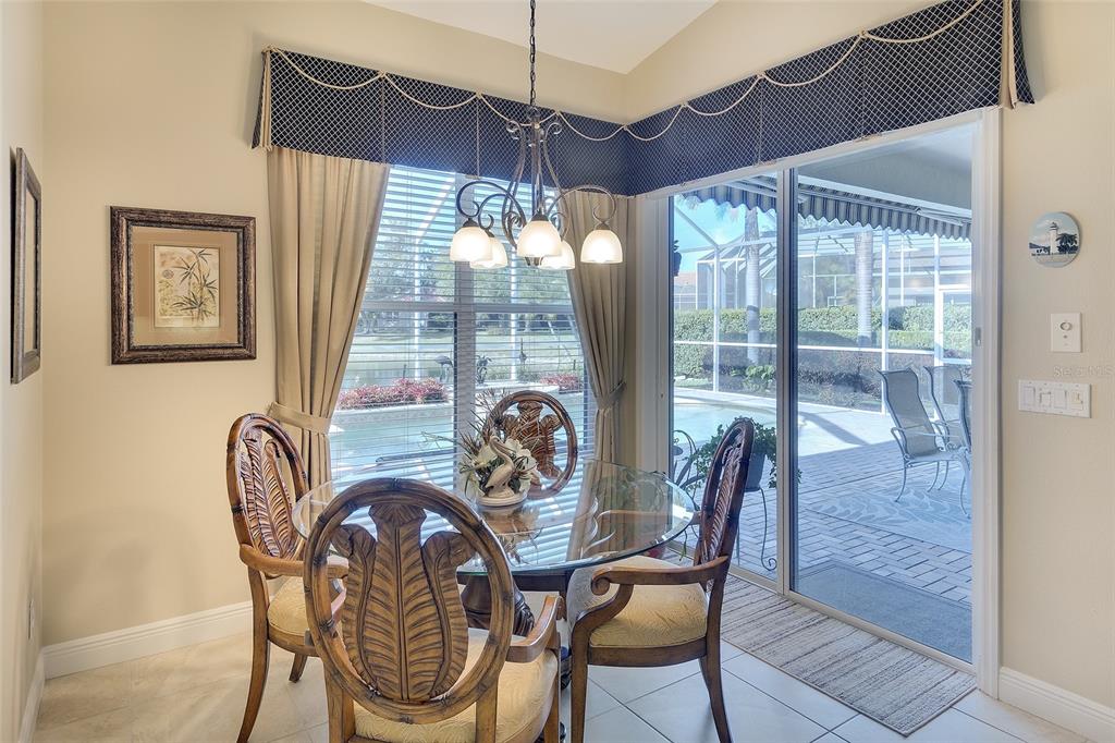 11809 Oak Ridge Drive Parrish, FL 34219 - Photo 15 of 39 a dining room with furniture and window