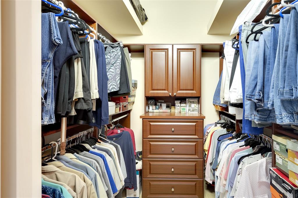 11809 Oak Ridge Drive Parrish, FL 34219 - Photo 19 of 39 a view of walk in closet with clothes and shoes
