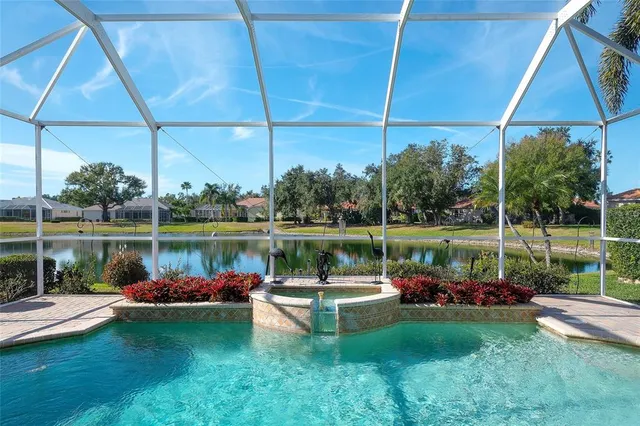 a view of a lake with a yard lake and outdoor seating