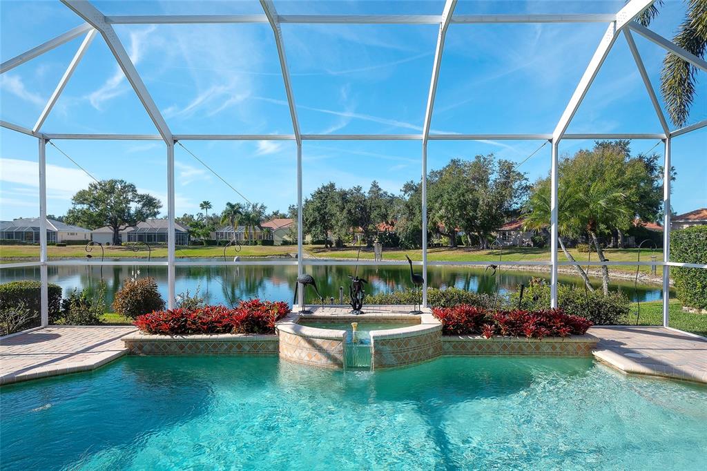 11809 Oak Ridge Drive Parrish, FL 34219 - Photo 28 of 39 a view of a lake with a yard lake and outdoor seating