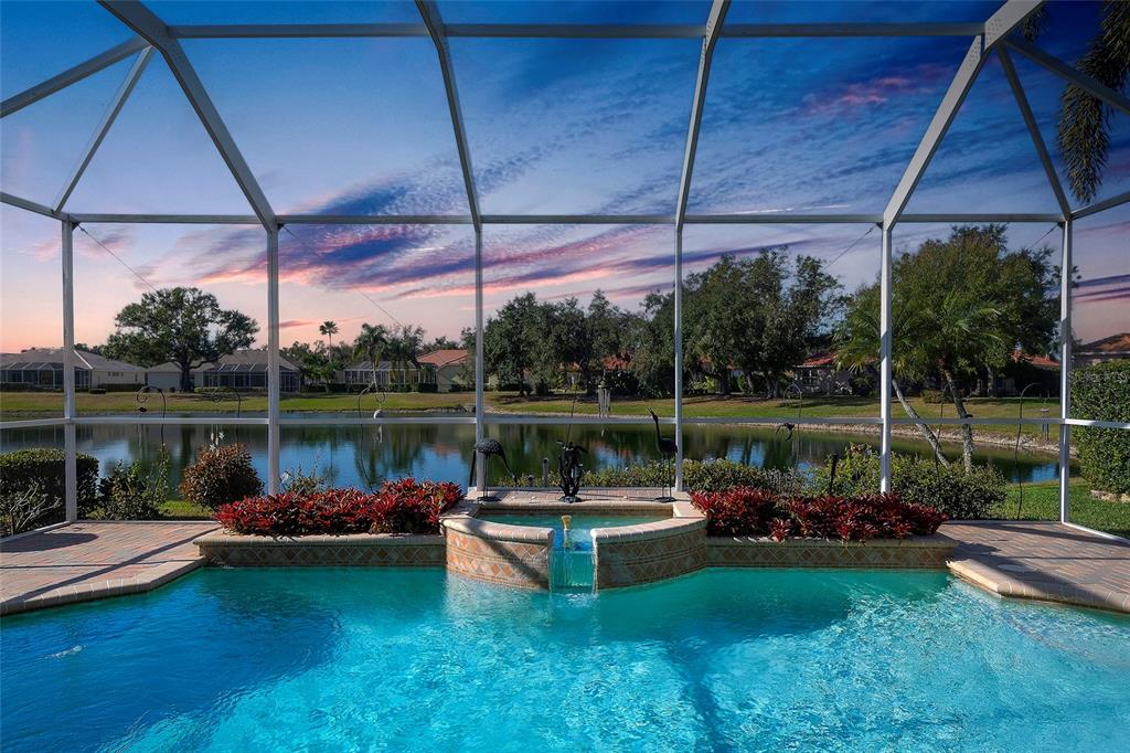 11809 Oak Ridge Drive Parrish, FL 34219 - Photo 31 of 39 a view of a lake with a patio