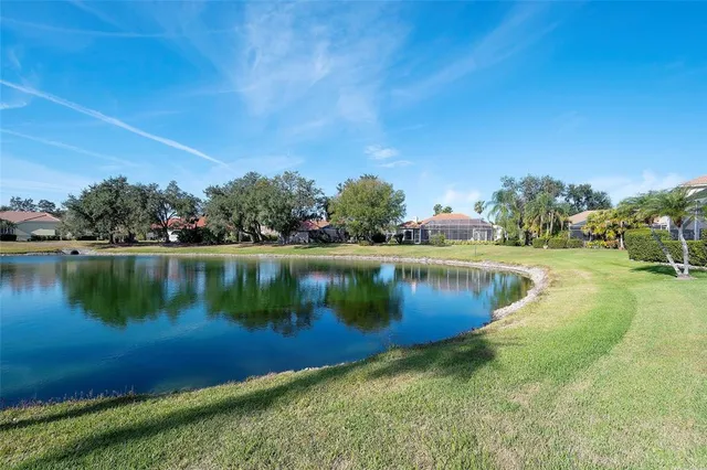 a view of a lake with a yard