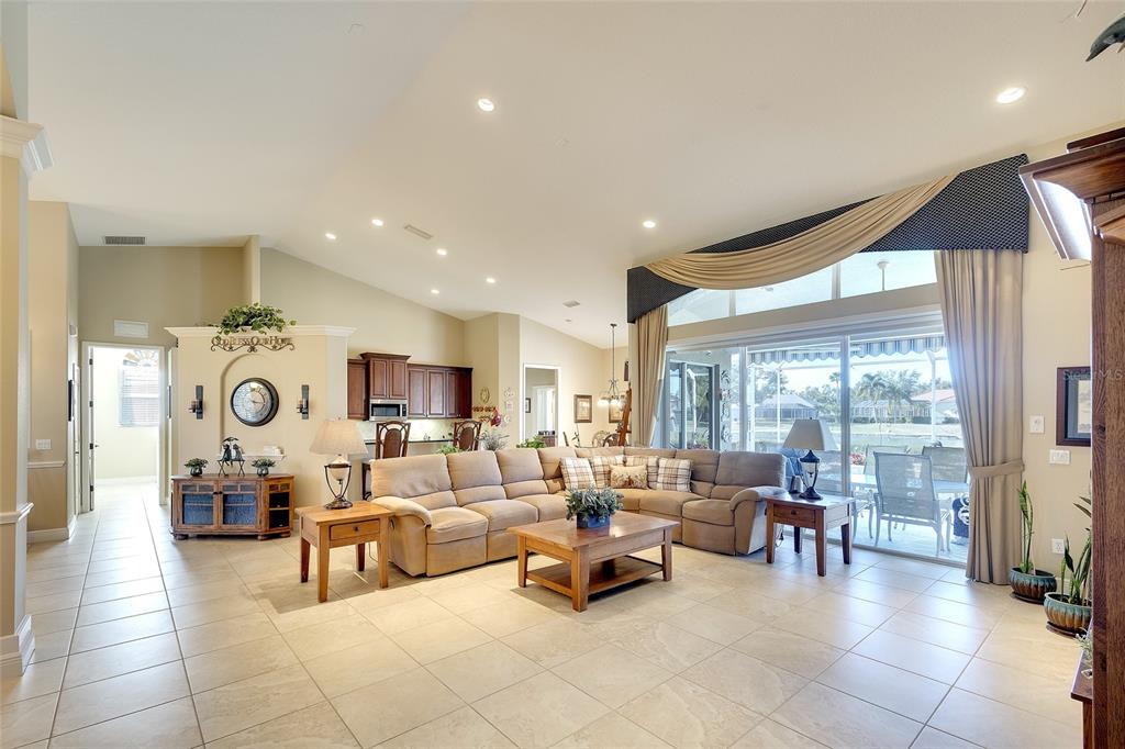 11809 Oak Ridge Drive Parrish, FL 34219 - Photo 8 of 39 a living room with furniture and a large window