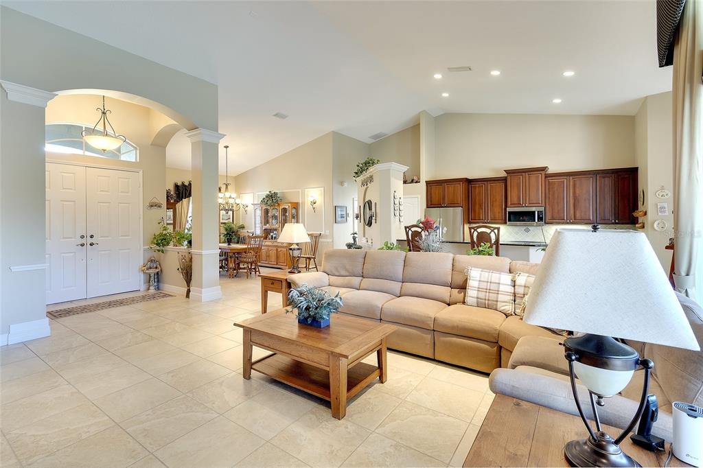 11809 Oak Ridge Drive Parrish, FL 34219 - Photo 10 of 39 a living room with furniture and kitchen view