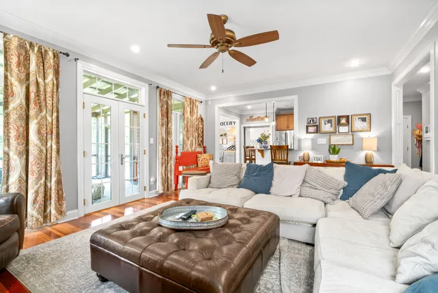 a kitchen with granite countertop stainless steel appliances a refrigerator cabinets and wooden floor