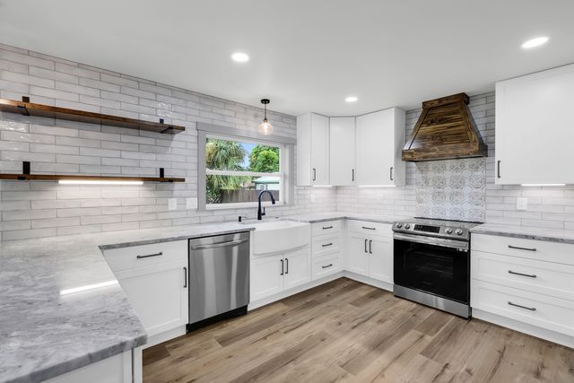 a view of an entryway with wooden floor