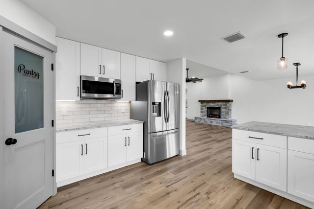 a bathroom with double vanity sink and a mirror