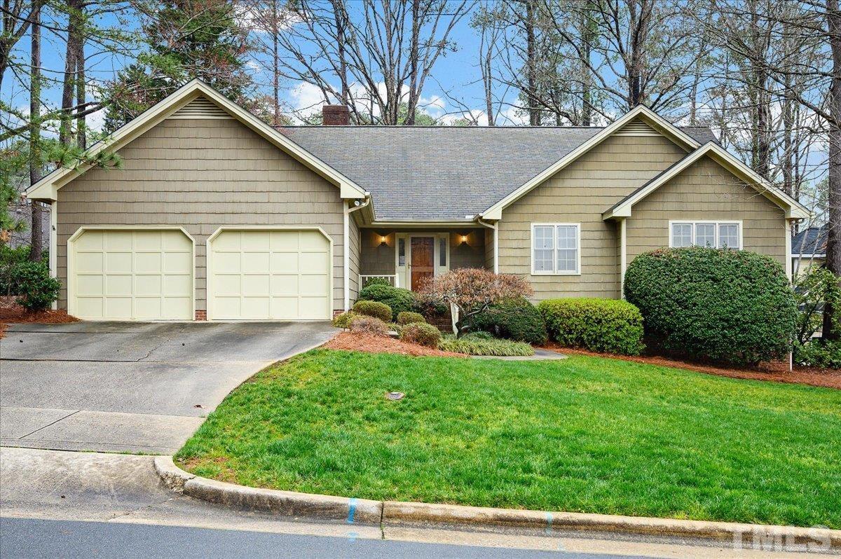 4112 Landfall Court Raleigh, NC 27613 - Photo 1 of 27 a view of a yard in front view of a house