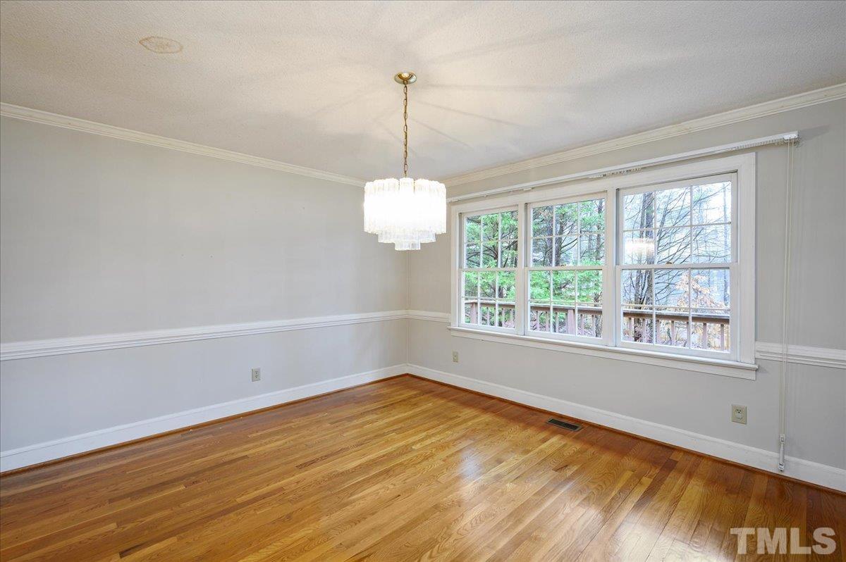 4112 Landfall Court Raleigh, NC 27613 - Photo 11 of 27 a view of a room with wooden floor and a window