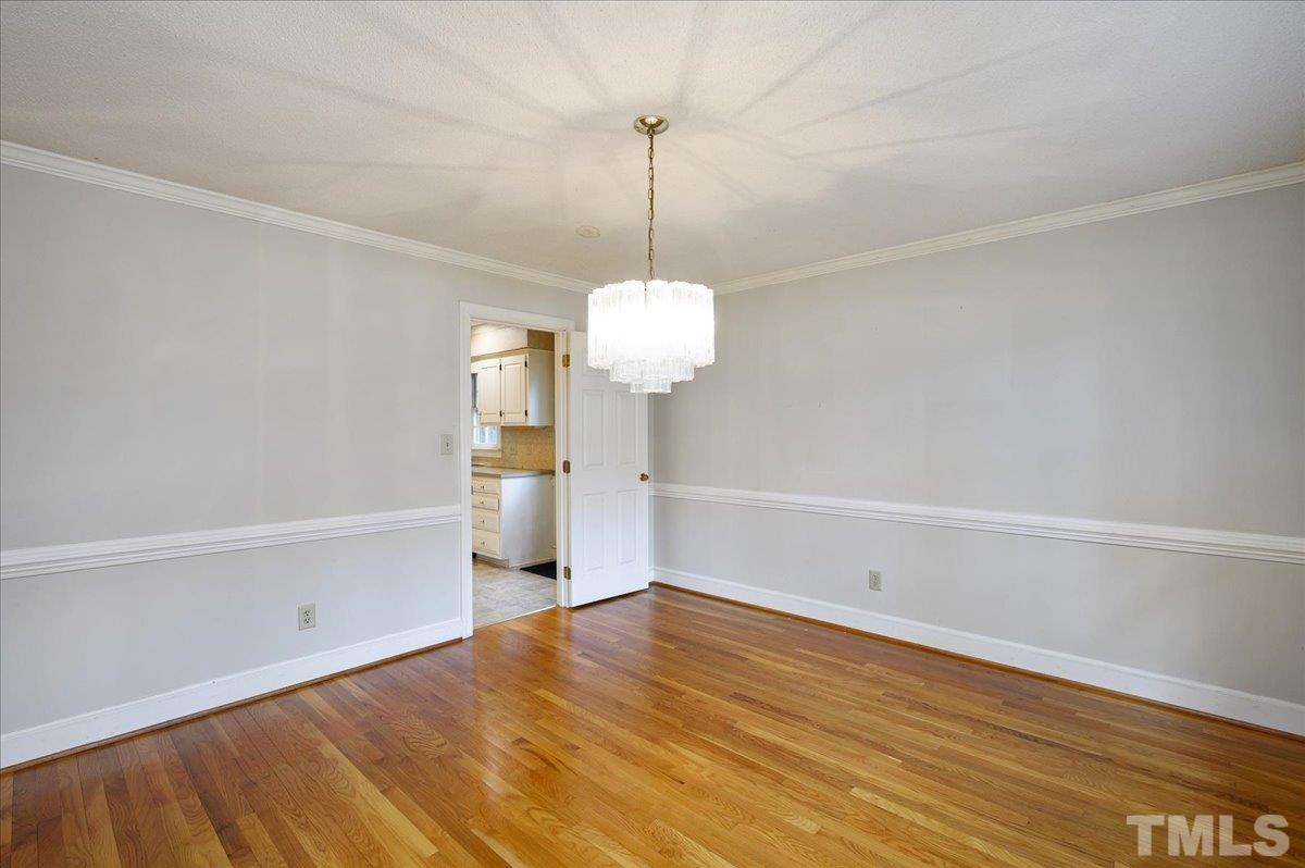 4112 Landfall Court Raleigh, NC 27613 - Photo 13 of 27 a view of a room with wooden floor and ceiling fan
