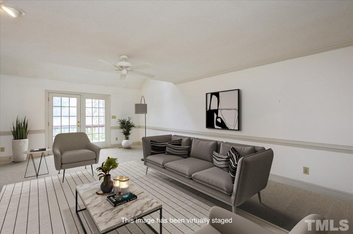 4112 Landfall Court Raleigh, NC 27613 - Photo 4 of 27 a living room with furniture rug and window