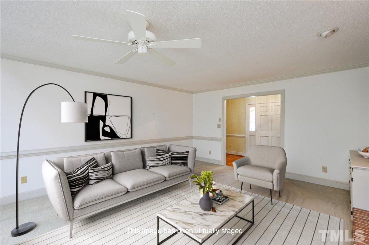4112 Landfall Court Raleigh, NC 27613 - Photo 6 of 27 a living room with furniture and a potted plant