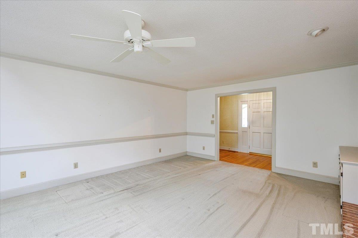 4112 Landfall Court Raleigh, NC 27613 - Photo 7 of 27 a view of an empty room