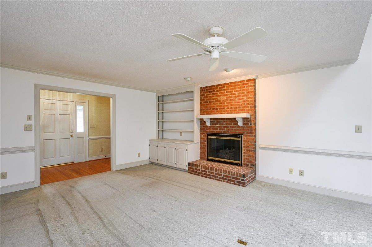 4112 Landfall Court Raleigh, NC 27613 - Photo 8 of 27 a view of a livingroom with a fireplace