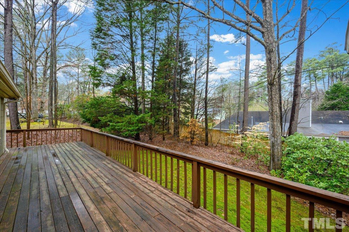 4112 Landfall Court Raleigh, NC 27613 - Photo 10 of 27 a view of balcony with wooden floor and fence