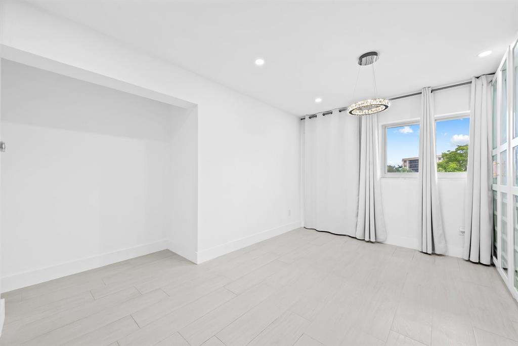 877 Northeast 195th Street, Unit 422 Miami, FL 33179 - Photo 12 of 23 a view of a room with a shower