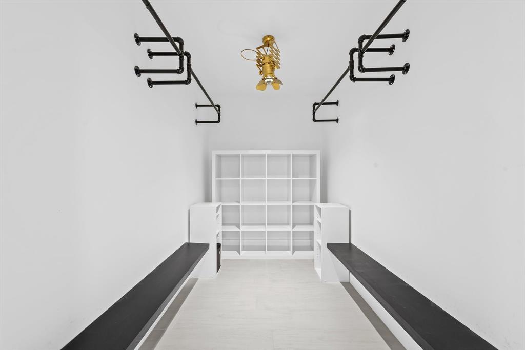 877 Northeast 195th Street, Unit 422 Miami, FL 33179 - Photo 7 of 23 a view of hallway with stairs and chandelier