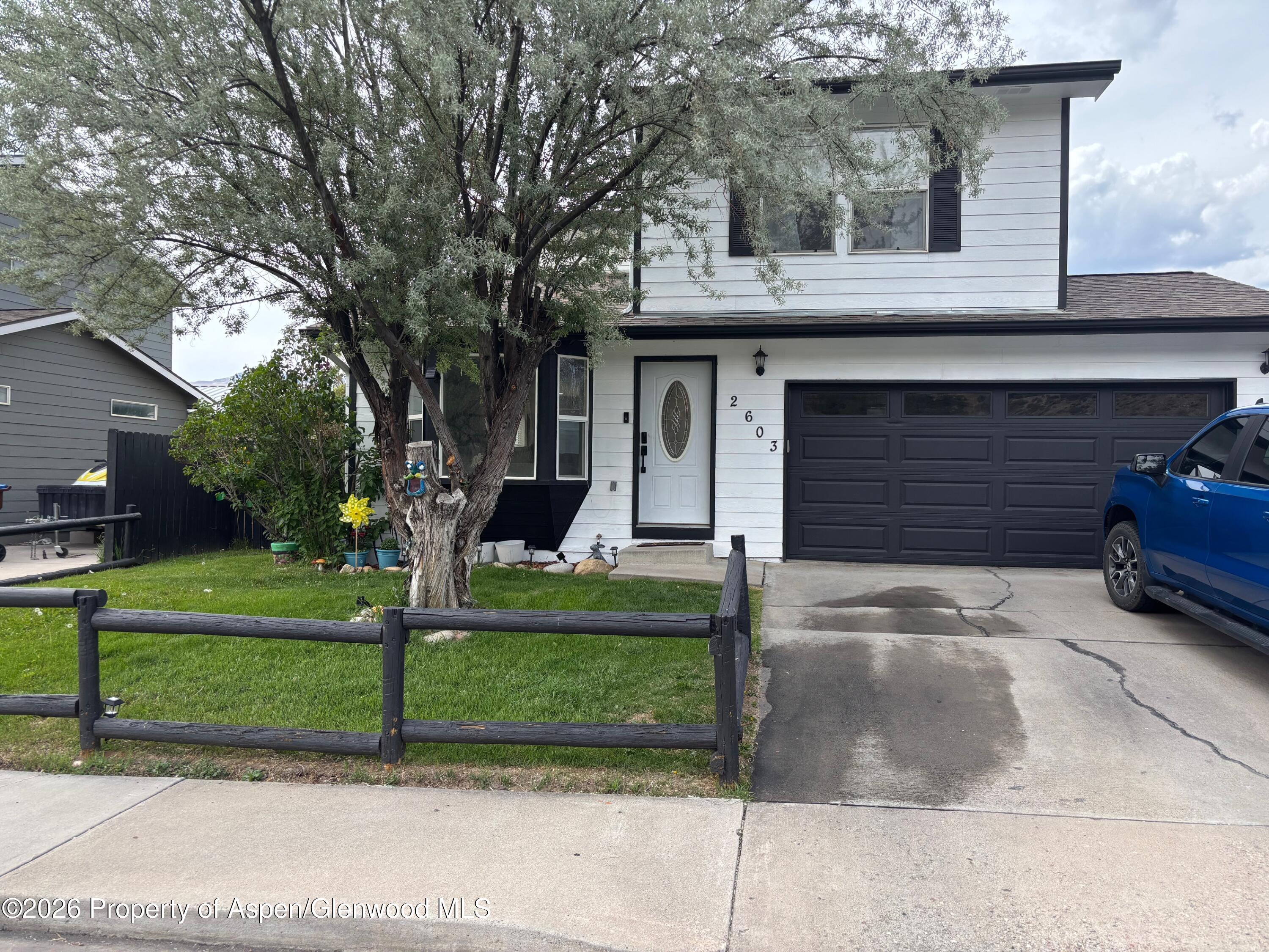 2603 Acacia Avenue Rifle, CO 81650 - Photo 1 of 29 a front view of a house with a yard