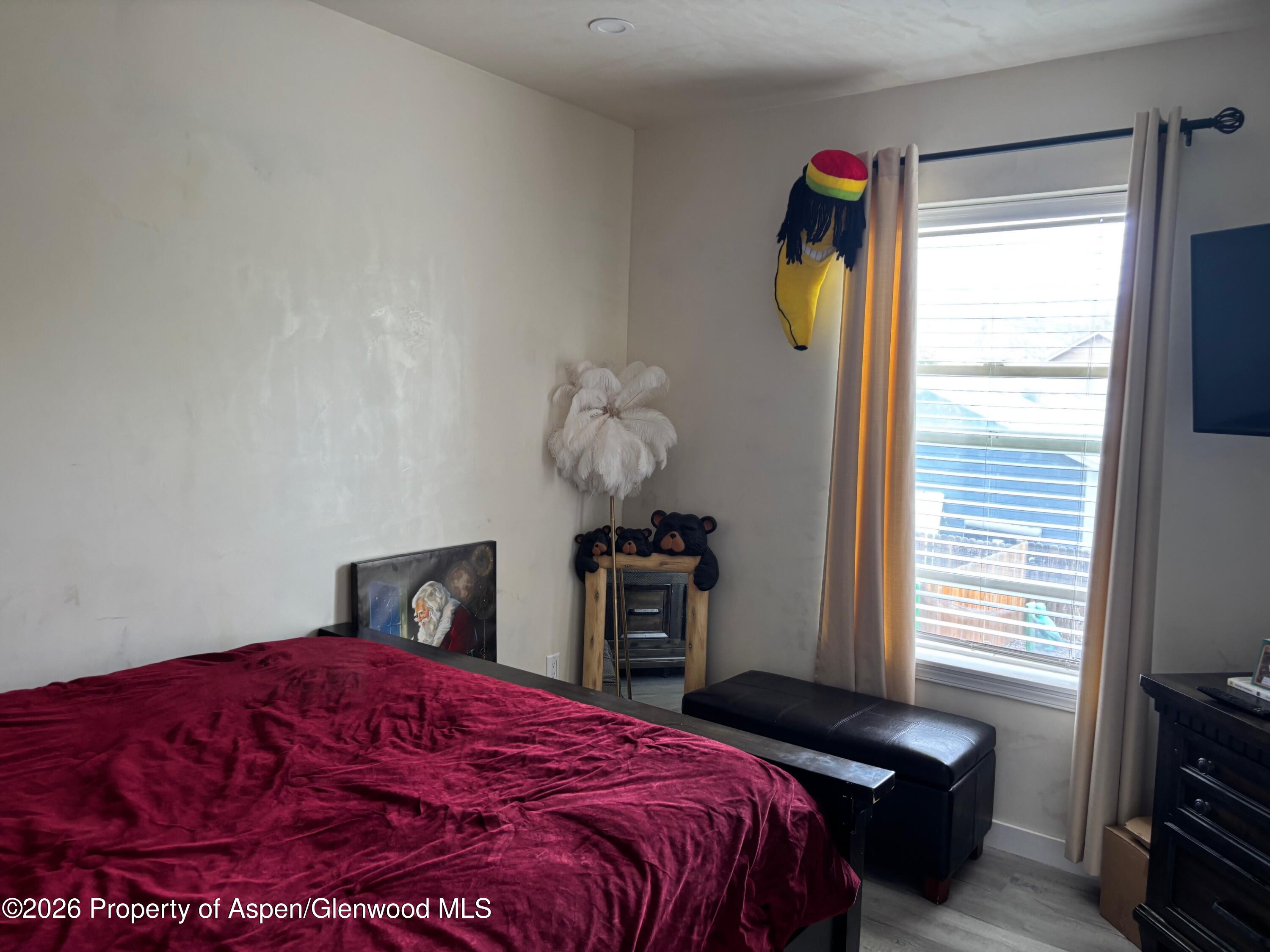 2603 Acacia Avenue Rifle, CO 81650 - Photo 14 of 29 a bedroom with a bed and a window