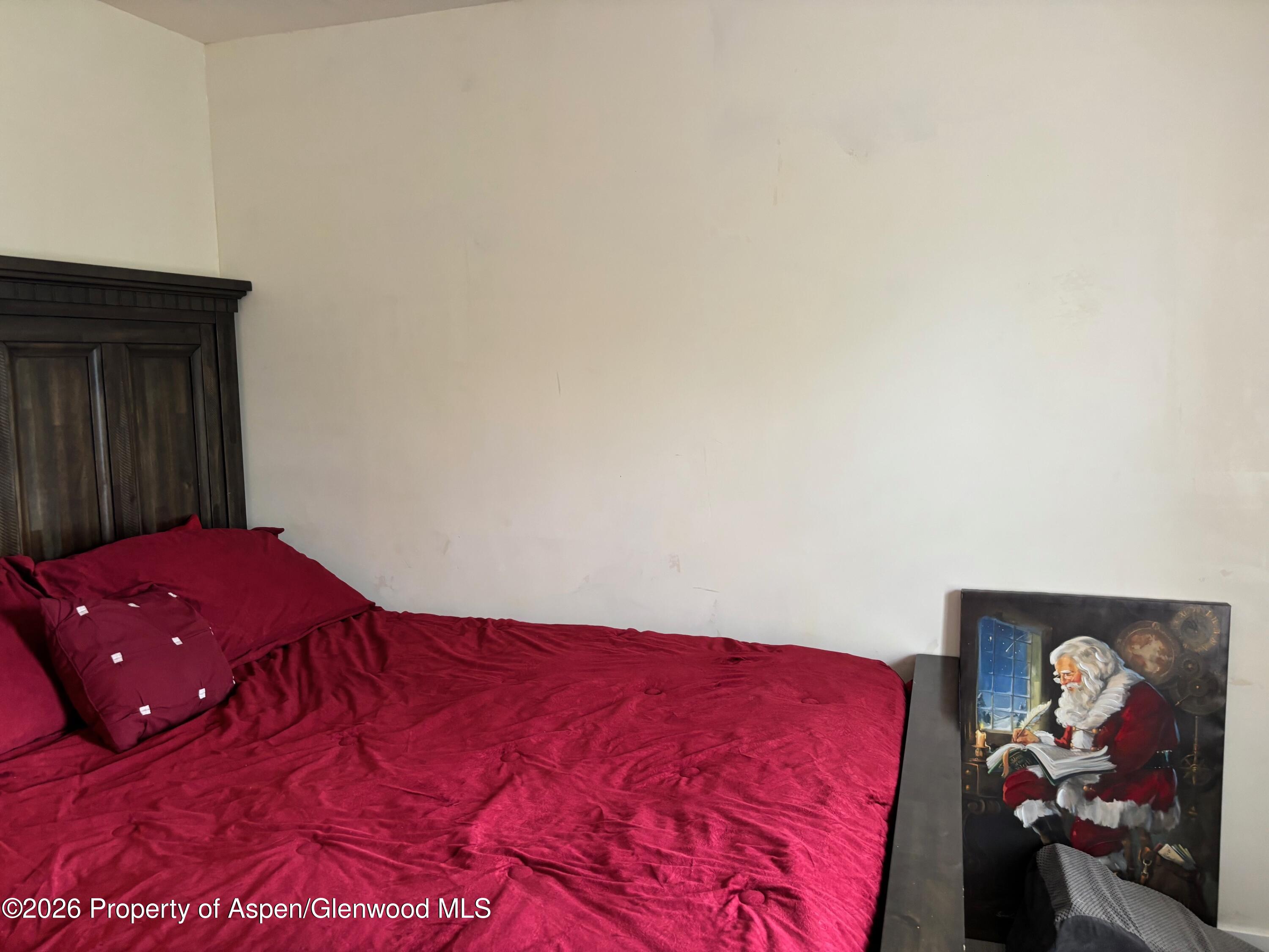 2603 Acacia Avenue Rifle, CO 81650 - Photo 15 of 29 a bedroom with a bed and a mirror
