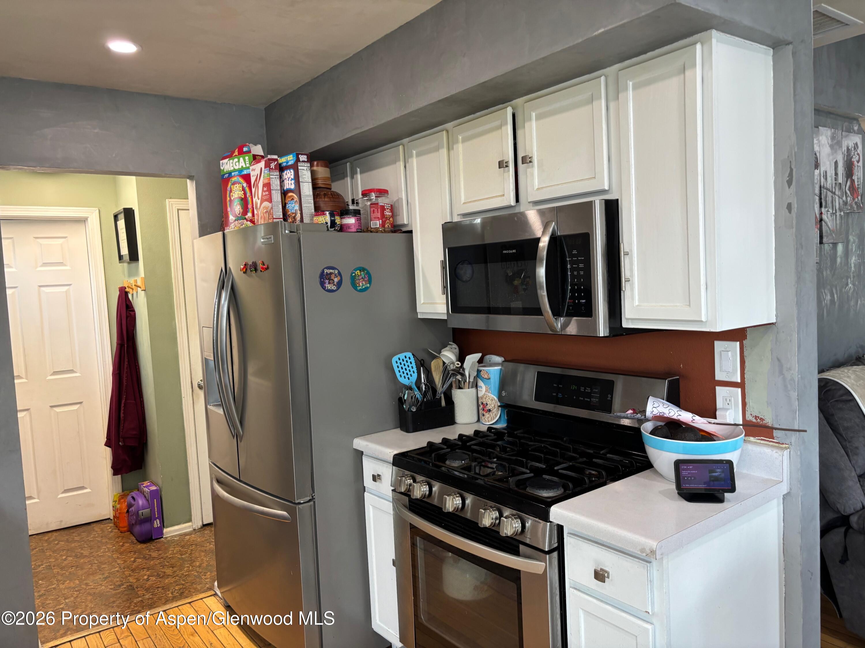 2603 Acacia Avenue Rifle, CO 81650 - Photo 2 of 29 a kitchen with stainless steel appliances granite countertop a refrigerator and a stove