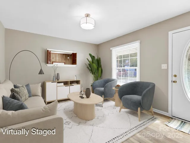 a living room with furniture and a window