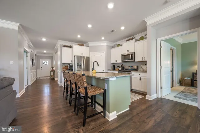 a kitchen with a refrigerator and a microwave