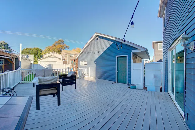 a view of a house with a deck and a patio