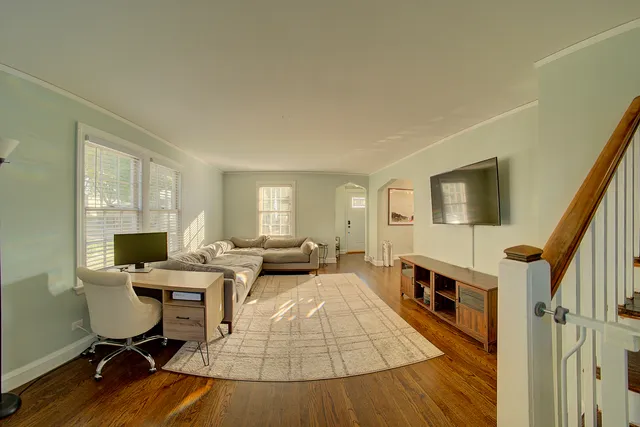 a view of a livingroom with furniture and a flat screen tv