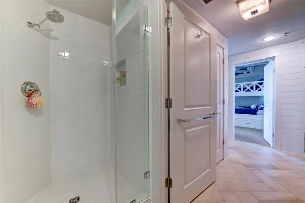a bathroom with a shower and a sink