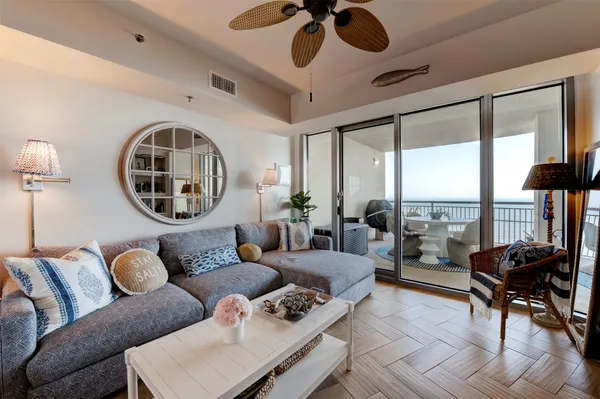 a living room with furniture and a large window