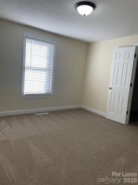 103 South Ridge Avenue, Unit 5 Kannapolis, NC 28083 - Photo 9 of 13 an empty room with a window