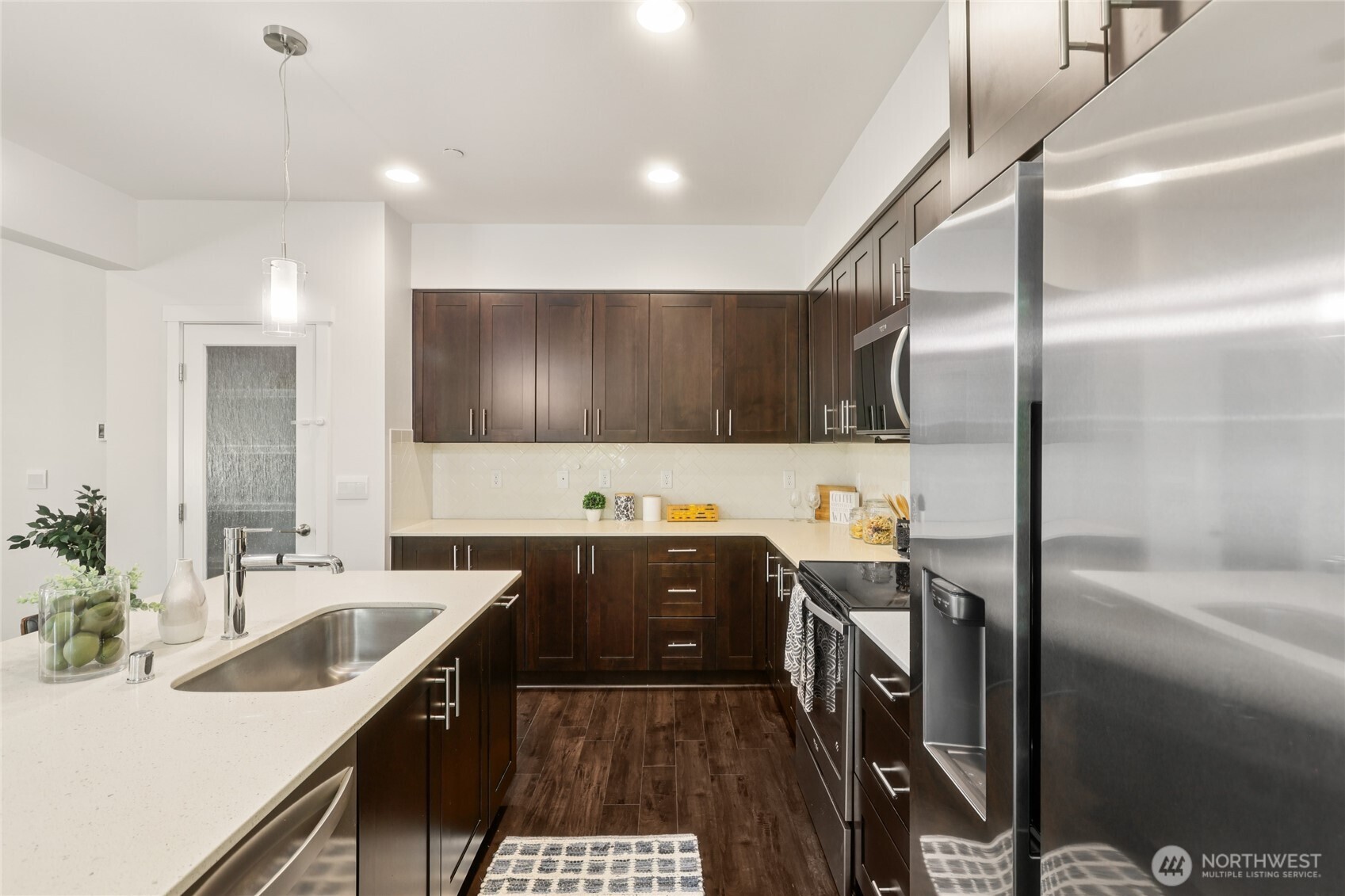 1325 Seattle Hill Road, Unit F5 Bothell, WA 98012 - Photo 12 of 40 a kitchen with a sink and refrigerator