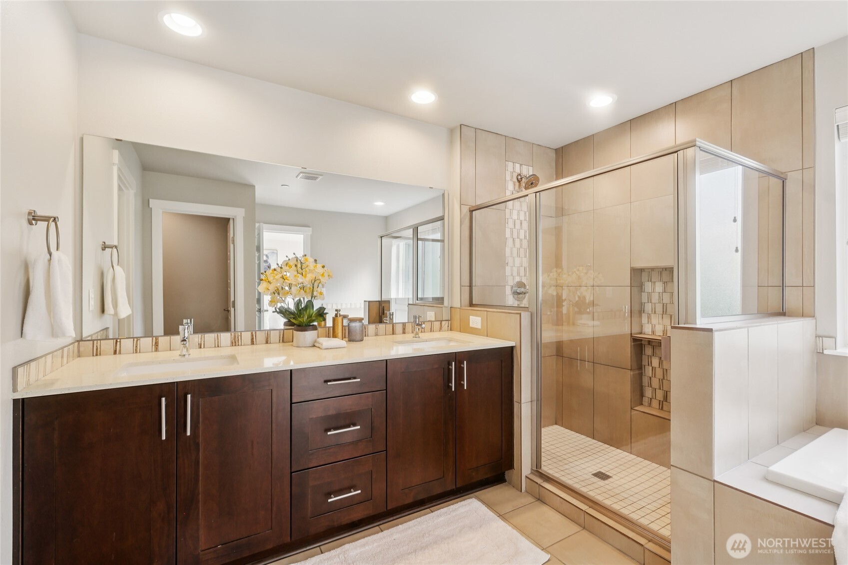 1325 Seattle Hill Road, Unit F5 Bothell, WA 98012 - Photo 20 of 40 a bathroom with a double vanity sink mirror double shower and a bathtub