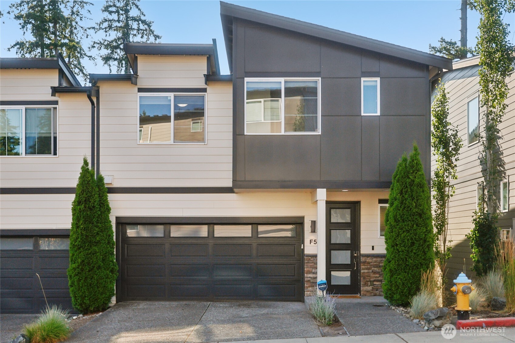 1325 Seattle Hill Road, Unit F5 Bothell, WA 98012 - Photo 2 of 40 a front view of a house with garage