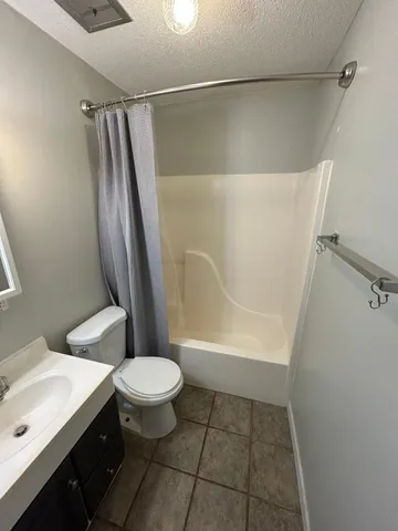 a kitchen with stainless steel appliances a refrigerator and cabinets