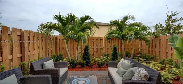 a house with palm tree in front of it