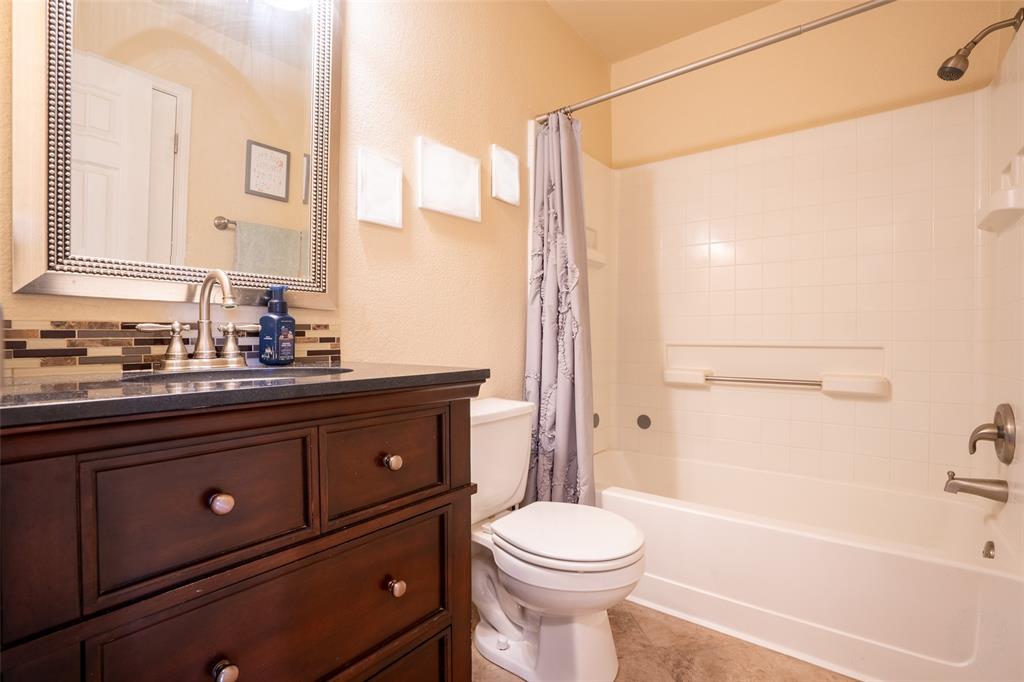 2924 Meandering Way Granbury, TX 76049 - Photo 23 of 40 a bathroom with a sink a toilet and shower