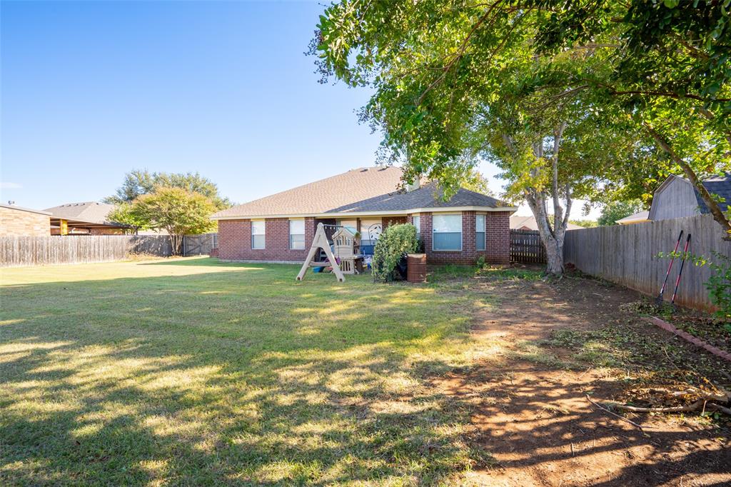 2924 Meandering Way Granbury, TX 76049 - Photo 28 of 40 a view of a house with a yard