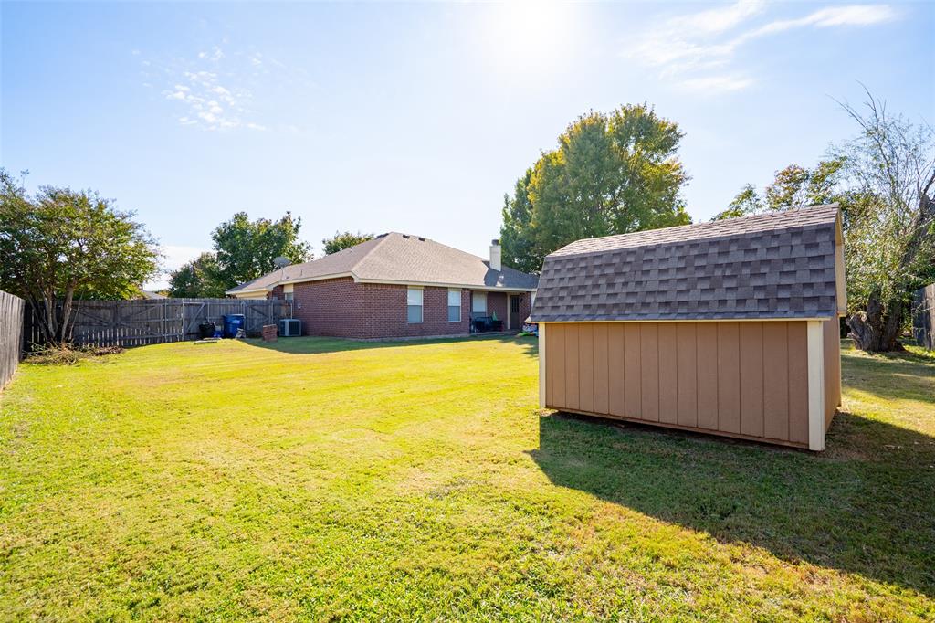 2924 Meandering Way Granbury, TX 76049 - Photo 30 of 40 a view of a swimming pool with an outdoor space and seating area