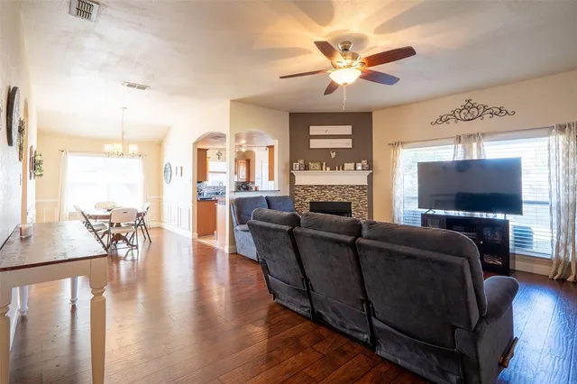 a living room with furniture and a flat screen tv