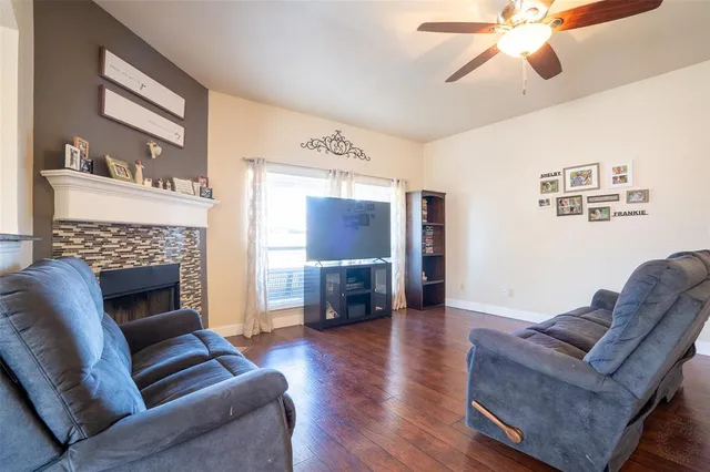 a living room with furniture or fireplace and a wooden floor