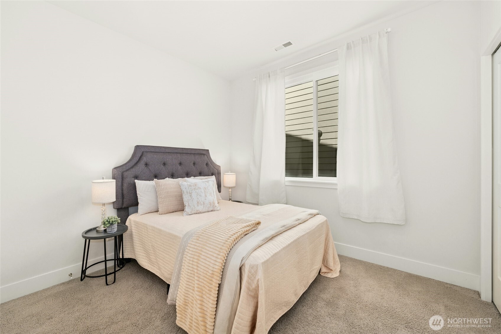 4309 231st Place Southeast Bothell, WA 98021 - Photo 13 of 40 a bedroom with a bed and a window