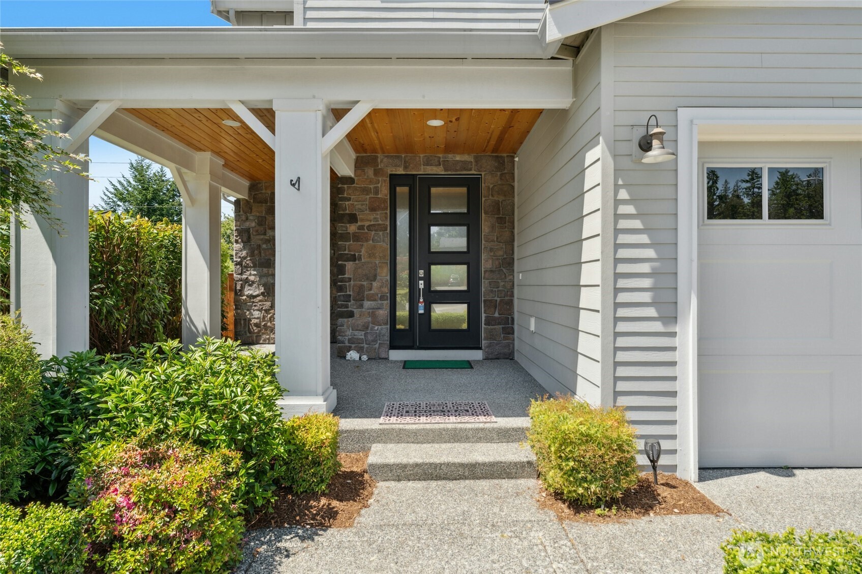 4309 231st Place Southeast Bothell, WA 98021 - Photo 2 of 40 a front view of a house with garden