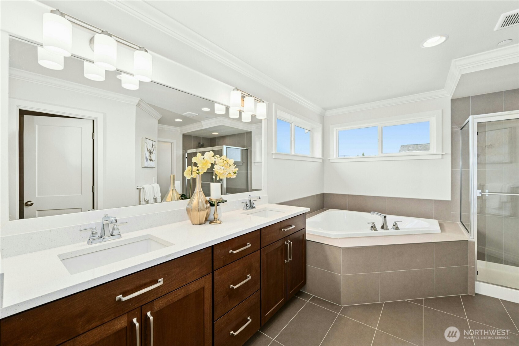 4309 231st Place Southeast Bothell, WA 98021 - Photo 21 of 40 a bathroom with a double vanity sink mirror and bathtub