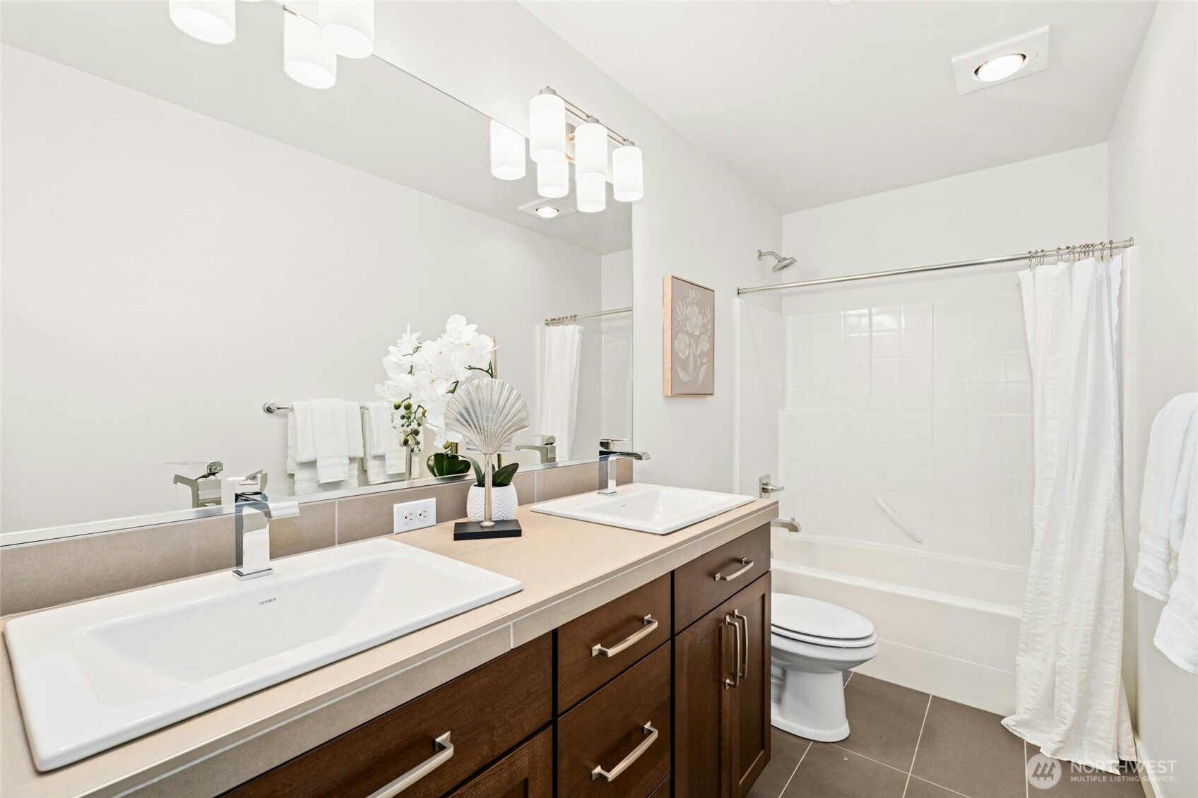 4309 231st Place Southeast Bothell, WA 98021 - Photo 26 of 40 a bathroom with a sink a toilet and a mirror