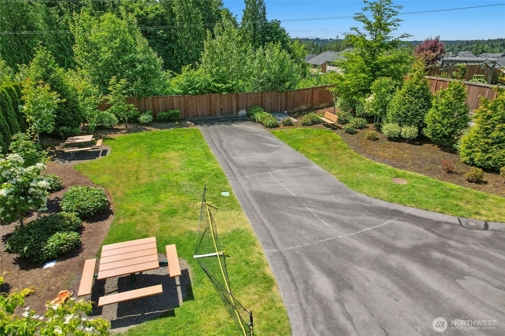 4309 231st Place Southeast Bothell, WA 98021 - Photo 35 of 40 a backyard of a house with a garden and plants
