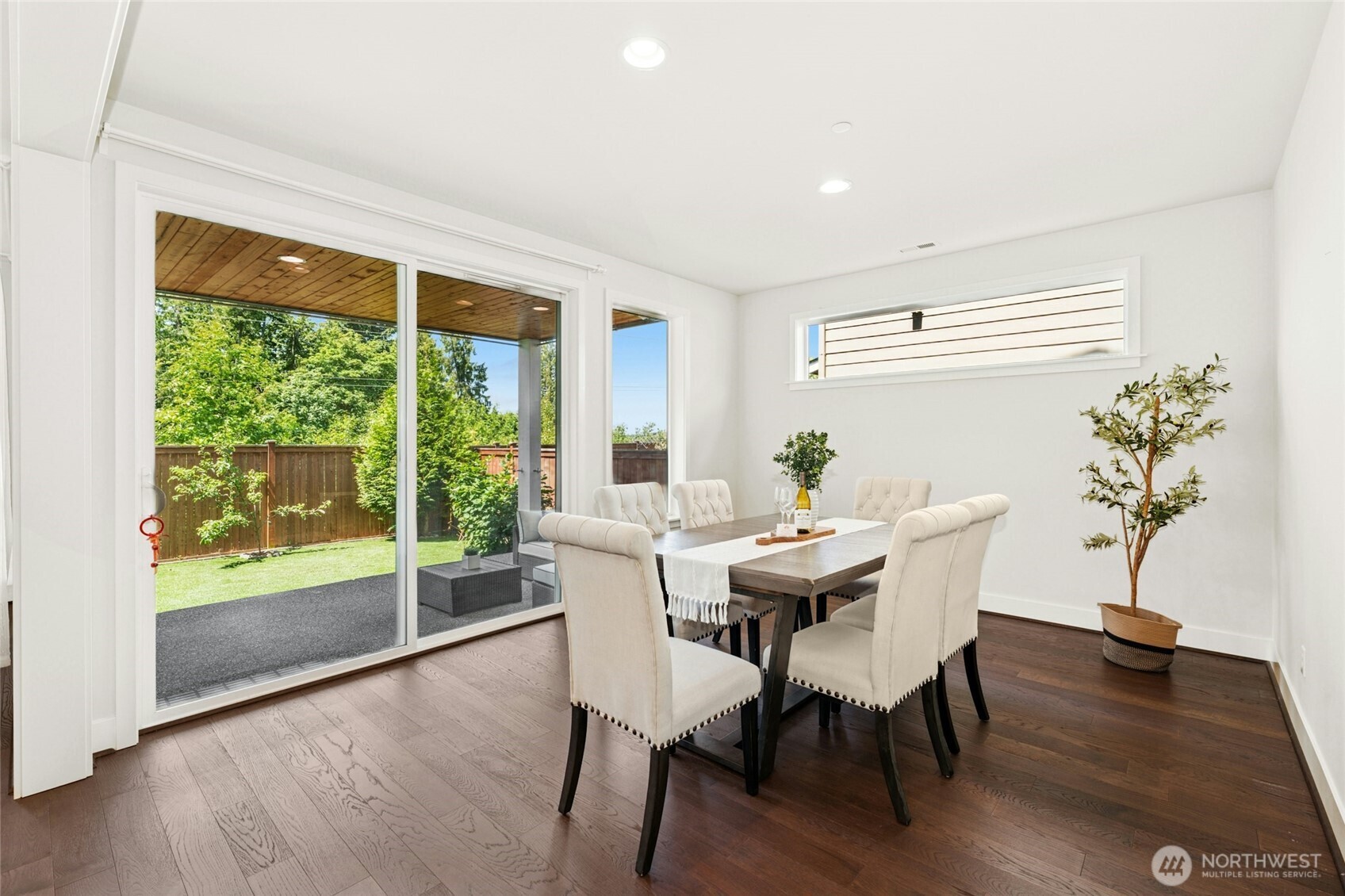 4309 231st Place Southeast Bothell, WA 98021 - Photo 10 of 40 a view of a dining room with furniture window and wooden floor