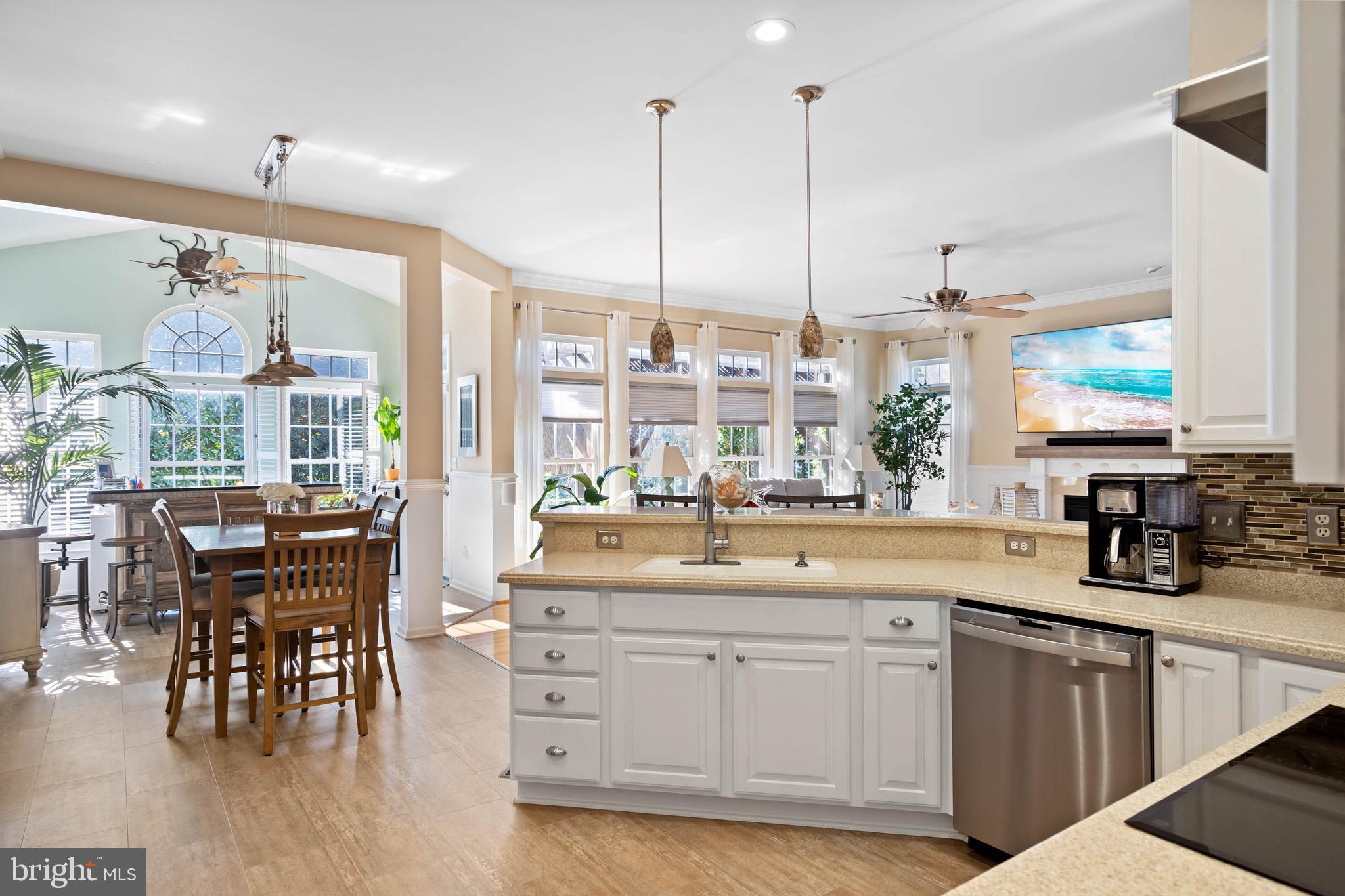 32876 Ocean Reach Lewes, DE 19958 - Photo 18 of 68 a kitchen with a table chairs and white cabinets