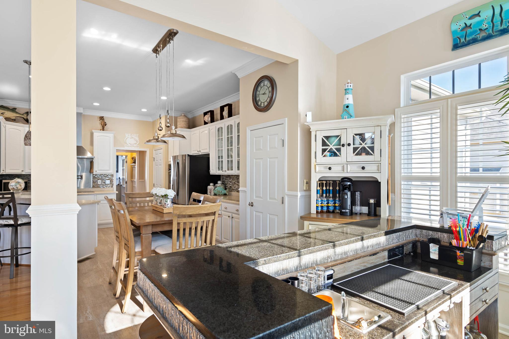 32876 Ocean Reach Lewes, DE 19958 - Photo 22 of 68 a kitchen with stainless steel appliances granite countertop a stove and a refrigerator